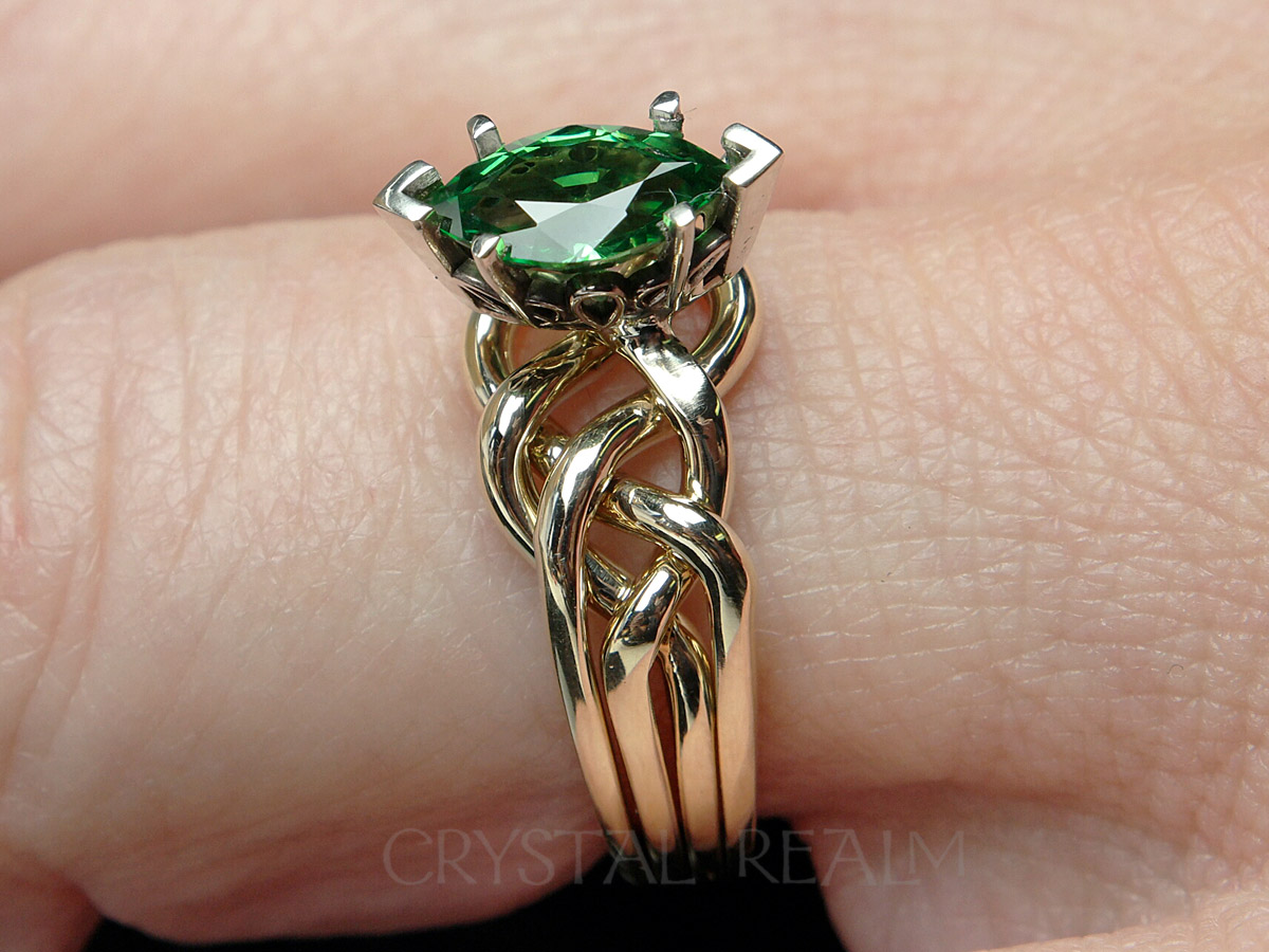 One carat 4 piece puzzle ring in medium-heavy 14k yellow gold and 1ct marquise tsavorite green garnet