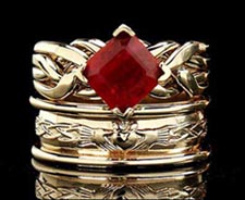 Cambridge puzzle ring with 2CT ruby and claddagh band with heavy trim