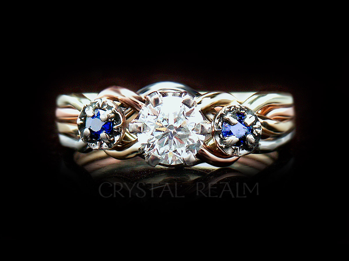Four color 4 piece puzzle ring with half carat round diamond and side sapphires