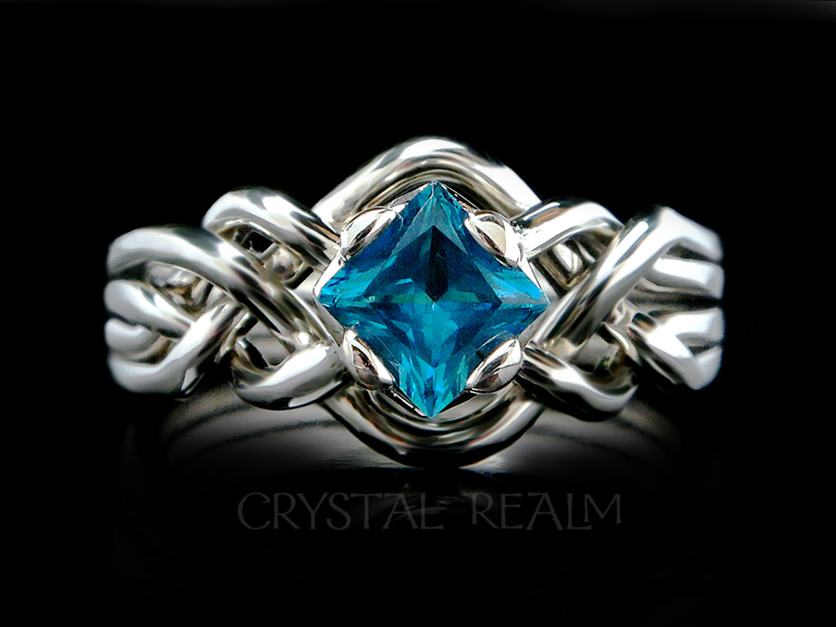 Avalon puzzle ring with 5mm Swiss blue topaz and open weave
