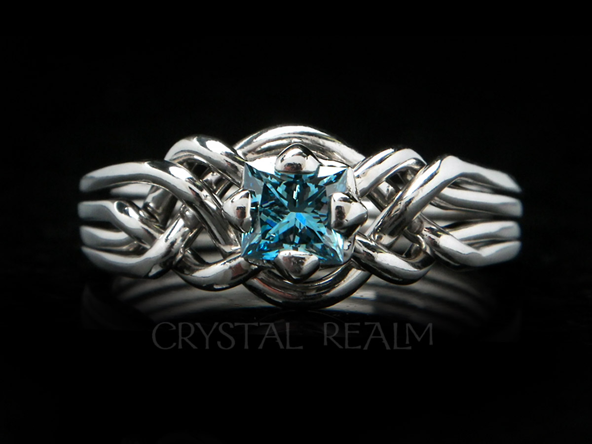 Four piece puzzle ring with princess-cut blue diamond