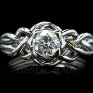4 piece puzzle ring with round brilliant diamond and open weave