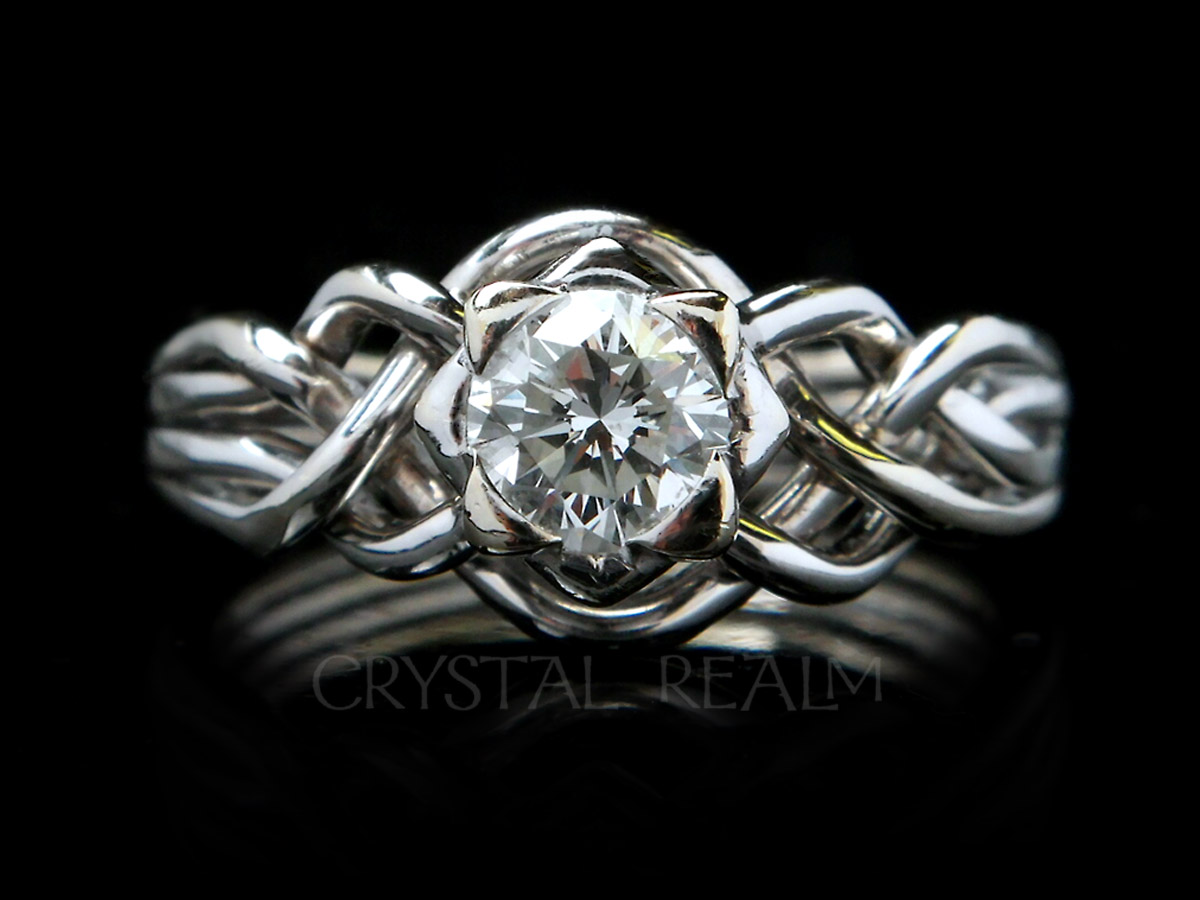 4 piece puzzle ring with round brilliant diamond and open weave