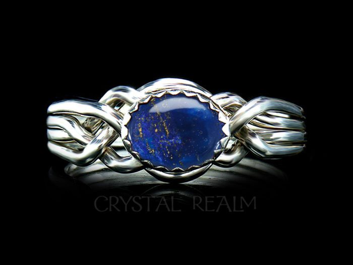 Our Avon Oval four-band puzzle ring bears a beautiful Lapis Lazuli stone from Afghanistan.