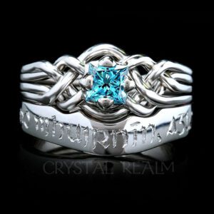 4 piece puzzle ring with blue diamond and hand-engraved wedding ring