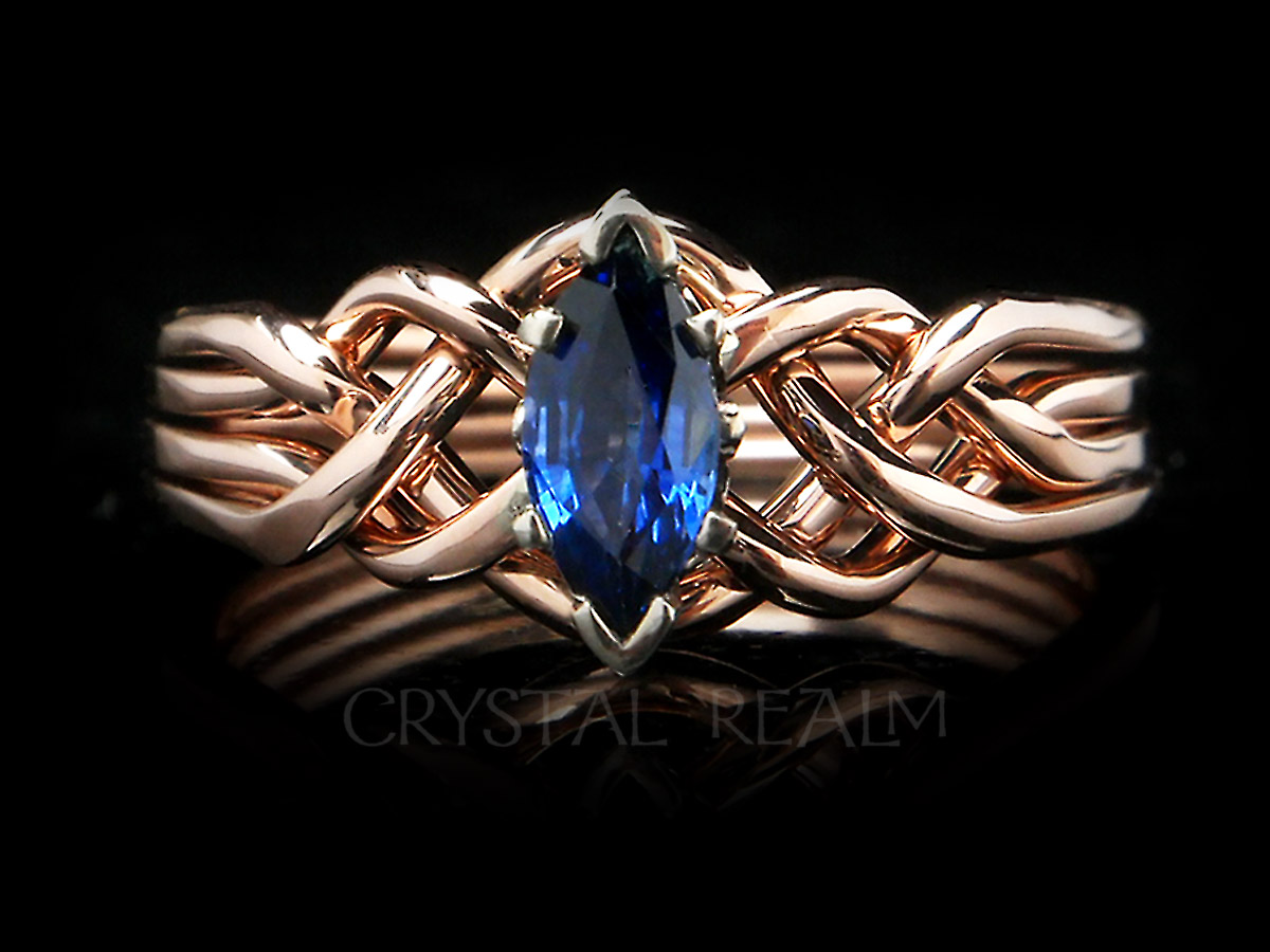Half-carat marquise sapphire puzzle ring with 14k rose gold bands and 14k white gold setting
