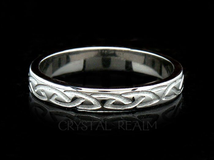 Irish Celtic wedding band with a recessed eternal knot design