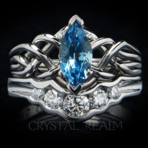 Four band puzzle ring with marquise aquamarine paired with a 5-diamond shadow band