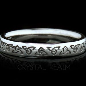 Irish Celtic wedding band with recessed trinity knots in palladium or white gold