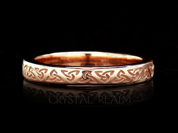 Irish Celtic wedding ring with trinity knots and 14k rose gold