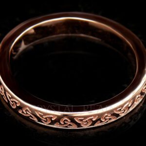 Rose gold Irish Celtic wedding band with inscribed trinity knots