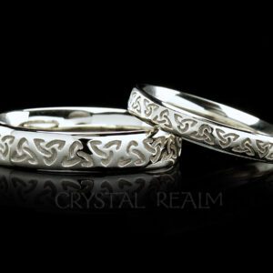 Celtic trinity knot wedding rings in two widths are shown in 14k white gold