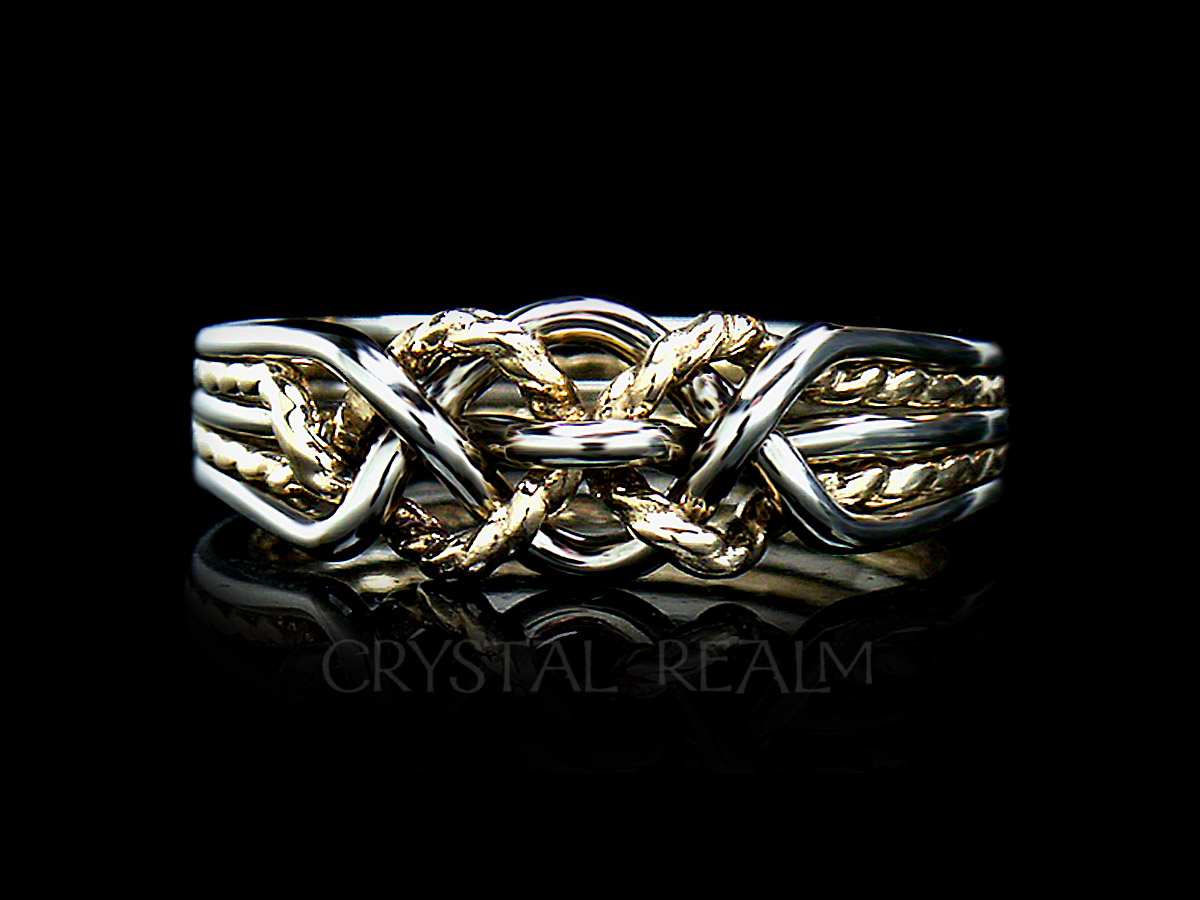 Five piece puzzle ring with a twisted yellow gold 'x' in medium weight is a difficult puzzle