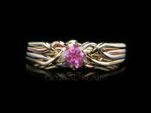 Four band puzzle ring with round pink tourmaline shown with four colors of 14K gold