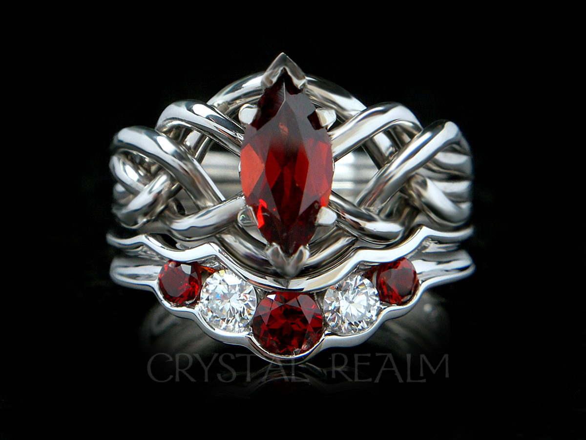 Four piece puzzle ring bridal set with one carat marquise garnet and wedding ring with garnets and diamonds