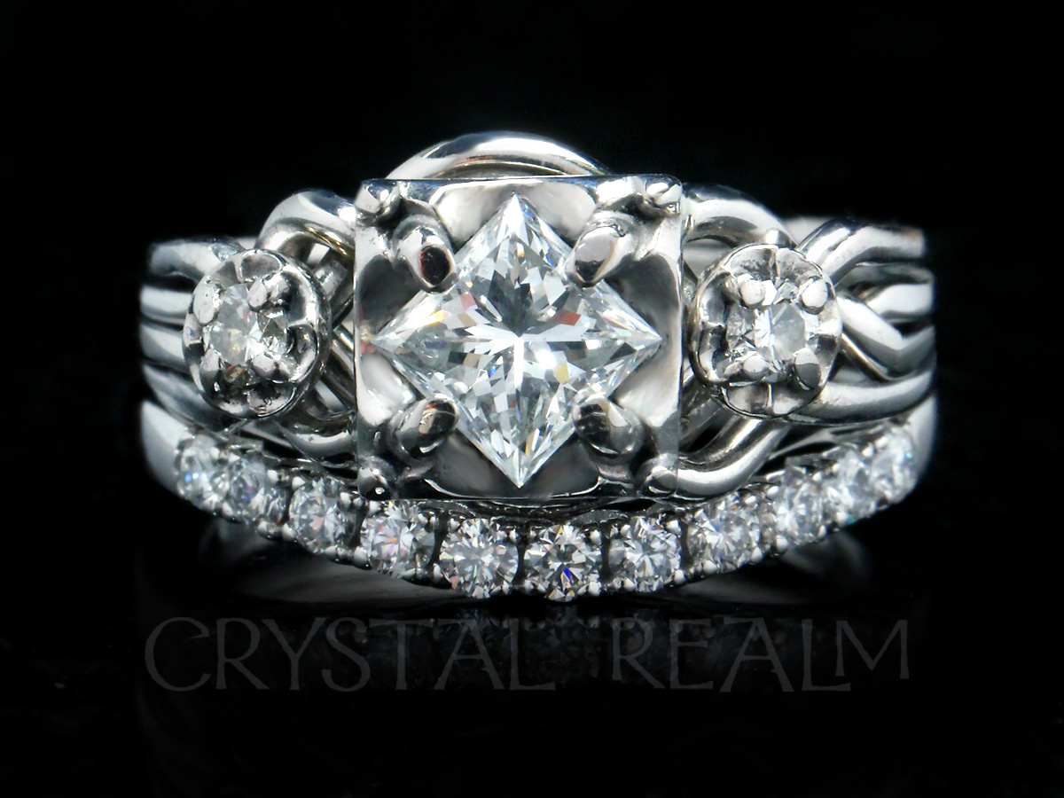four-band puzzle ring with princess-cut diamond and accent diamonds with a diamond shadow band
