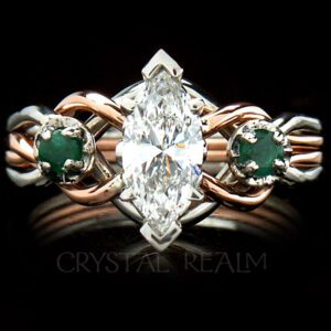 Marquise diamond open-weave engagement puzzle ring with side emeralds shown in platinum and 14K rose gold