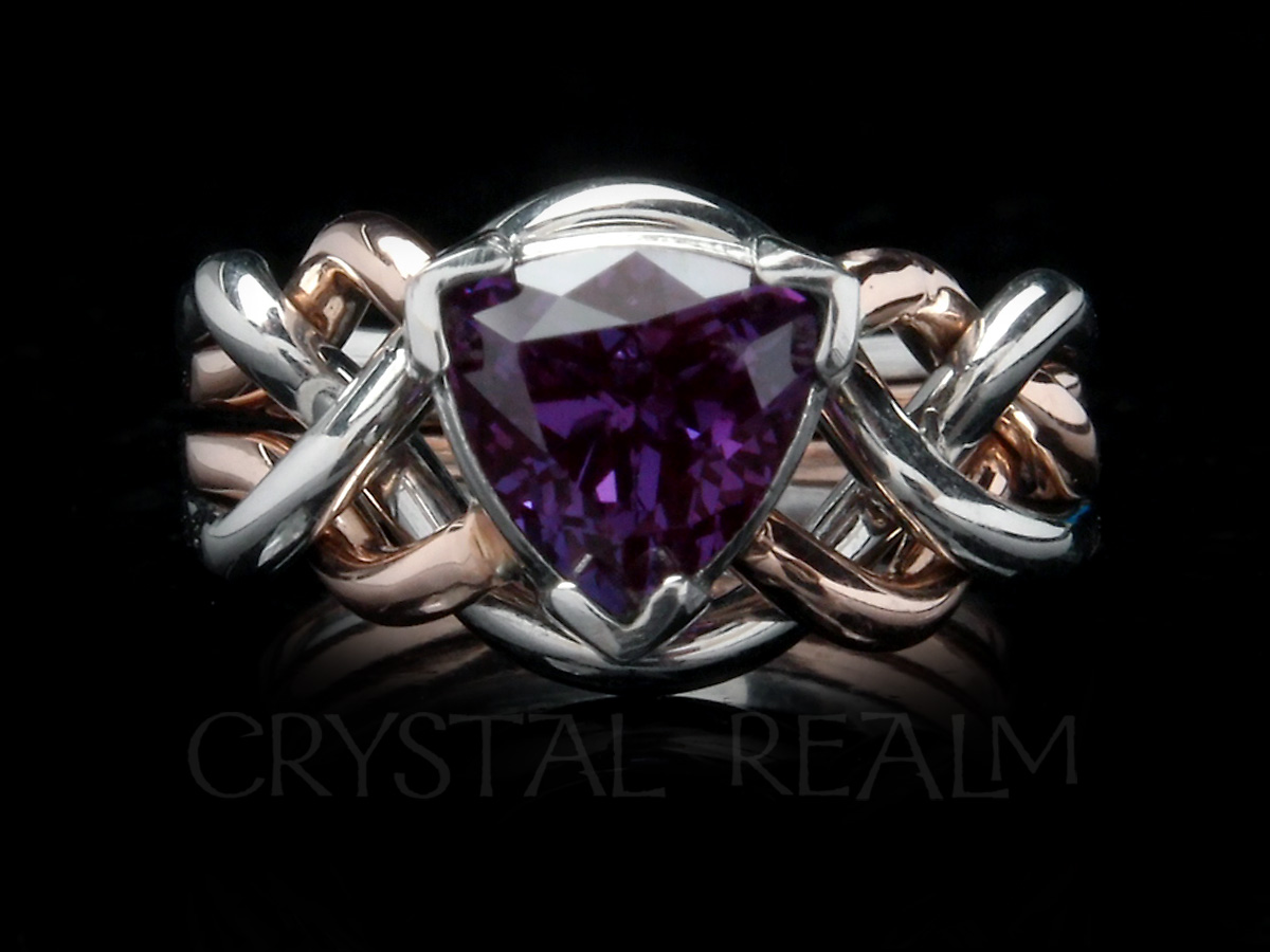 trillion cut, lab-created alexandrite on just-over-medium-weight four-band puzzle ring
